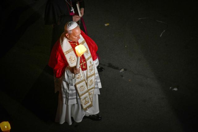 Pope Leo XIV takes part in a torchlight procession following the Rosary Prayer at the Shrine of Our Lady of Lourdes, southwestern France, on September 27, 2026 on the third day of his visit to France. (Photo by Alberto PIZZOLI / AFP)