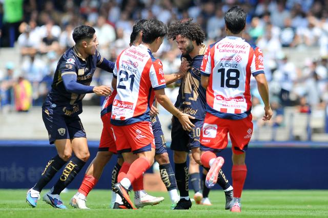 Pumas' forward #10 Cesar Huerta scuffles with San Luis' midfielder #21 Oscar Macias and San Luis' defender #18 Aldo Cruz during the Liga MX Apertura tournament football match between Pumas and San Luis at the Olimpico Universitario stadium in Mexico City on September 27, 2026. (Photo by Victor CRUZ / AFP)