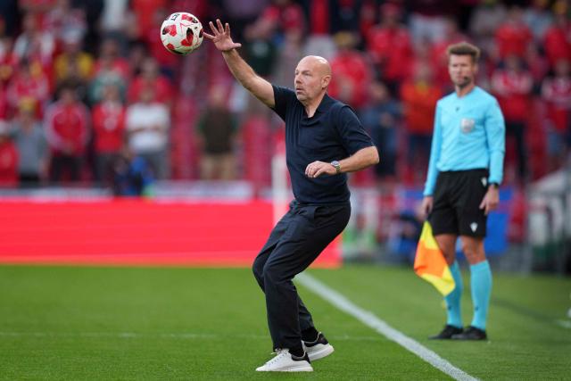 Denmark's head coach Brian Riemer reaches for the ball during the UEFA Nations League Group A4 football match between Denmark and Wales in Copenhagen on September 27, 2026. (Photo by Liselotte Sabroe / Ritzau Scanpix / AFP) / Denmark OUT