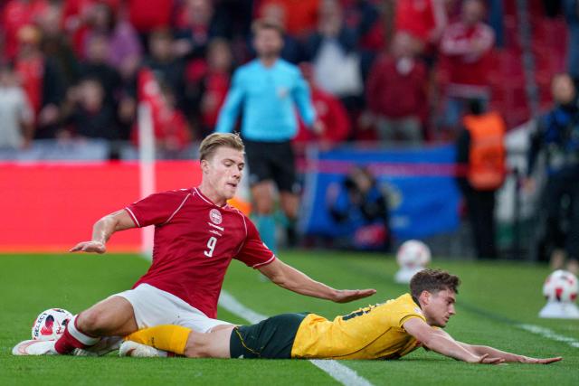 Denmark's forward #09 Rasmus Hojlund and Wales' forward #20 Daniel James vie for the ball during the UEFA Nations League Group A4 football match between Denmark and Wales in Copenhagen on September 27, 2026. (Photo by Liselotte Sabroe / Ritzau Scanpix / AFP) / Denmark OUT