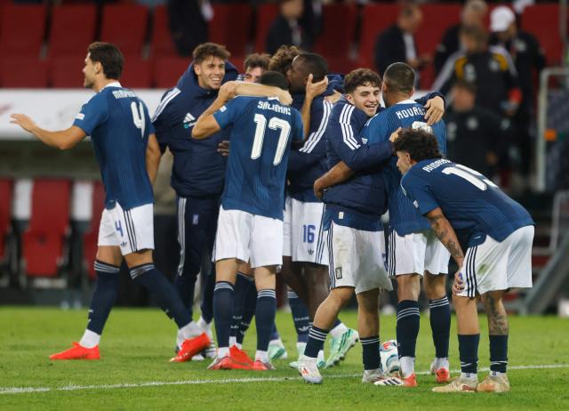 Greece's players celebrate after the UEFA Nations League Group A2 between Germany and Greece in Augsburg, southern Germany on September 27, 2026. (Photo by Michaela STACHE / AFP)