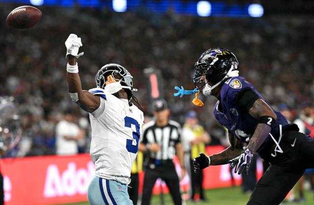 Dallas Cowboys' wide receiver #03 George Pickens misses a pass next to Baltimore Ravens' cornerback #02 Nate Wiggins during the NFL match between the Dallas Cowboys and the Baltimore Ravens at the Maracana Stadium in Rio de Janeiro, Brazil, on September 27, 2026. (Photo by MAURO PIMENTEL / AFP)