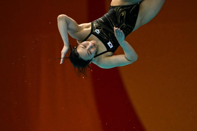 South Korea's Kim Su-ji competes in the women's 1m springboard final diving event during the 2026 Asian Games at the Tokyo Aquatics Centre in Tokyo on September 28, 2026. (Photo by ANDREW CABALLERO-REYNOLDS / AFP)