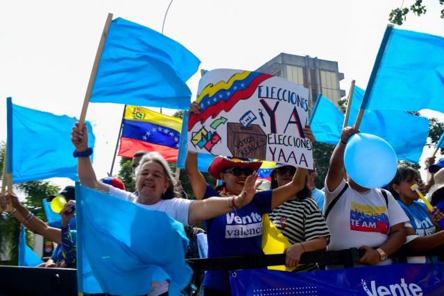 Demonstrators attend a rally to demand the return of opposition leader Maria Corina Machado to the country on a street in Valencia, Carabobo Sate on Sepetember 27, 2026. Supporters of Machado mobilized in caravans across several regions on September 27, 2026, to demand her "safe return" to the country. (Photo by Jacinto OLIVEROS / AFP)