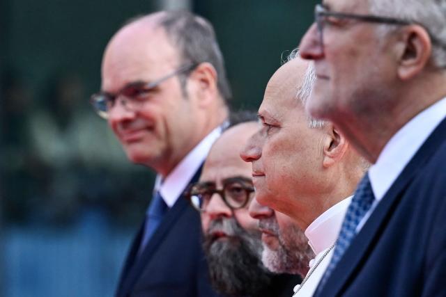 Pope Leo XIV (2nd R) arrives with other religious leaders to attend an interfaith meeting at the Robert Schuman Conference Centre in Metz northeastern France on September 28, 2026 on the last day of his visit to France. (Photo by Jean-Christophe VERHAEGEN / AFP)