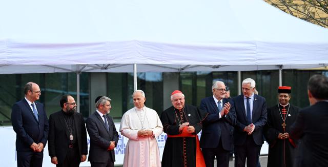 (From 3rd L) Chief Rabbi of France Haim Korsia, Pope Leo XIV, French archbishop Jean-Marc Aveline, and Franco-Algerian lawyer and Rector of Paris' Grand Mosque Chems-eddine Hafiz, pose upon arrival for an interfaith meeting at the Robert Schuman Conference Centre in Metz, northeastern France, on September 28, 2026 on the last day of the Pope visit to France. (Photo by Jean-Christophe VERHAEGEN / AFP)