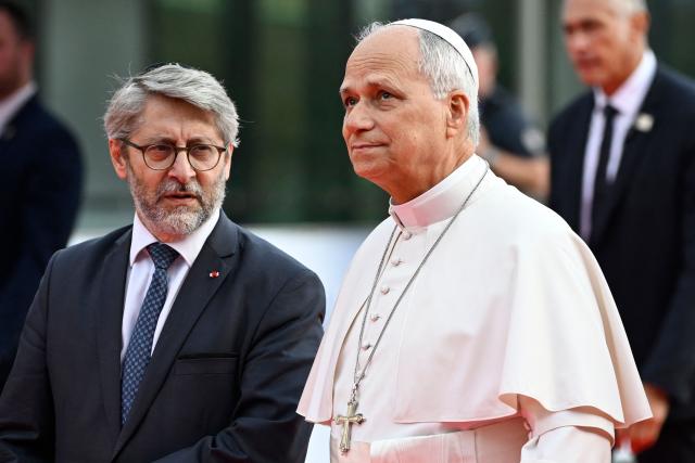 Pope Leo XIV (R) arrives with Chief Rabbi of France Haim Korsia (L) and other religious leaders to attend an interfaith meeting at the Robert Schuman Conference Centre in Metz northeastern France on September 28, 2026 on the last day of his visit to France. (Photo by Jean-Christophe VERHAEGEN / AFP)