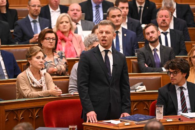 Hungarian Prime minister Peter Magyar (C) speaks at the Hungarian parliament in Budapest on September 28, 2026, as the Parliament lifted his parliamentary immunity, allowing criminal proceedings against him. Magyar is being probed for theft over a 2024 incident, where prosecutors allege he snatched a phone from a man filming him in a nightclub and threw it into the river Danube. He has called for his immunity to be lifted in the case he has long described as a "sham". (Photo by Attila KISBENEDEK / AFP)