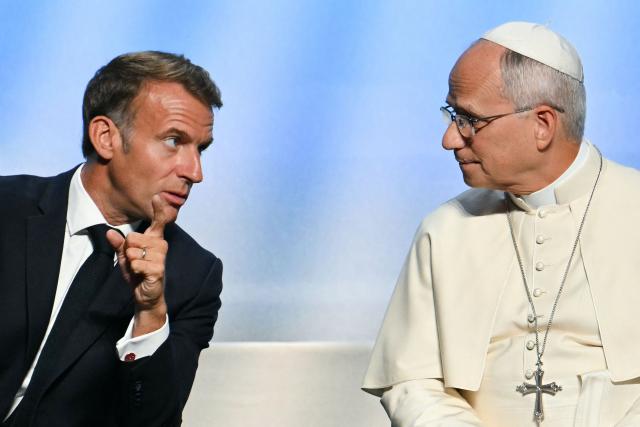 Pope Leo XIV (R) speaks with France's President Emmanuel Macron (L) during a meeting called "At the Roots of Europe: For Peace and Unity", in presence of at the Robert Schuman Conference Centre in Metz, northeastern France, on September 28, 2026 on the last day of the Pope visit to France. (Photo by Alberto PIZZOLI / AFP)