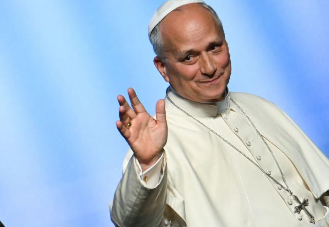 Pope Leo XIV waves as he leaves at the end of a meeting called "At the Roots of Europe: For Peace and Unity", at the Robert Schuman Conference Centre in Metz, northeastern France, on September 28, 2026 on the last day of his visit to France. (Photo by Alberto PIZZOLI / AFP)
