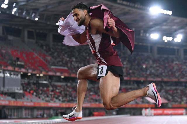 Qatar's Bassem Hemeida poses as he celebrates winning the men's 400m hurdles final during the 2026 Asian Games at Nagoya City Mizuho Park Athletic Stadium in Nagoya, Aichi Prefecture on September 28, 2026. (Photo by MOHD RASFAN / AFP)