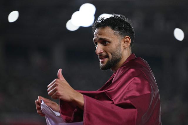 Qatar's Bassem Hemeida celebrates after winning the men's 400m hurdles final during the 2026 Asian Games at Nagoya City Mizuho Park Athletic Stadium in Nagoya, Aichi Prefecture on September 28, 2026. (Photo by MOHD RASFAN / AFP)