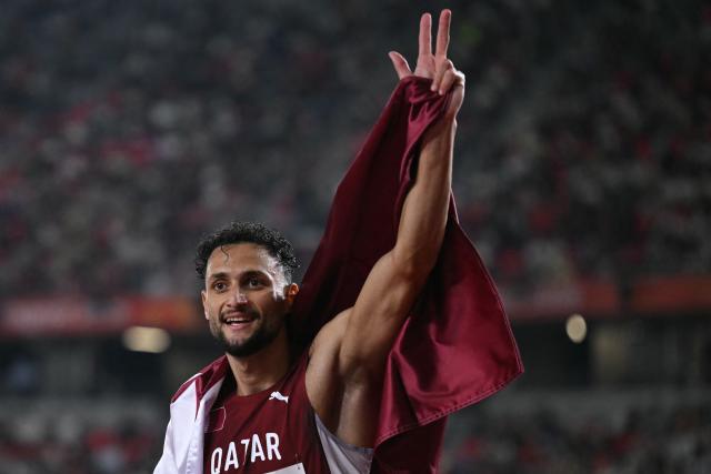 Qatar's Bassem Hemeida celebrates after winning the men's 400m hurdles final during the 2026 Asian Games at Nagoya City Mizuho Park Athletic Stadium in Nagoya, Aichi Prefecture on September 28, 2026. (Photo by MOHD RASFAN / AFP)