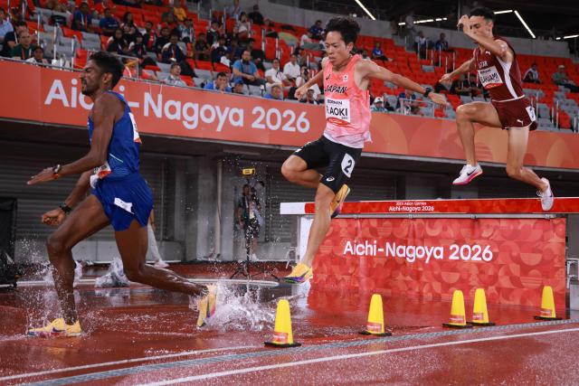 Japan's Ryoma Aoki (C), India's Avinash Sable (L) and Qatar's Zakaria Elahlaami compete in the men's 3000m steeplechase final during the 2026 Asian Games at Nagoya City Mizuho Park Athletic Stadium in Nagoya, Aichi Prefecture on September 28, 2026. (Photo by DAVID GRAY / AFP)