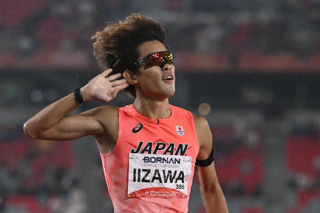 Japan's Kazuto Iizawa celebrates setting a games record to win men's 1500m final during the 2026 Asian Games at Nagoya City Mizuho Park Athletic Stadium in Nagoya, Aichi Prefecture on September 28, 2026. (Photo by MOHD RASFAN / AFP)