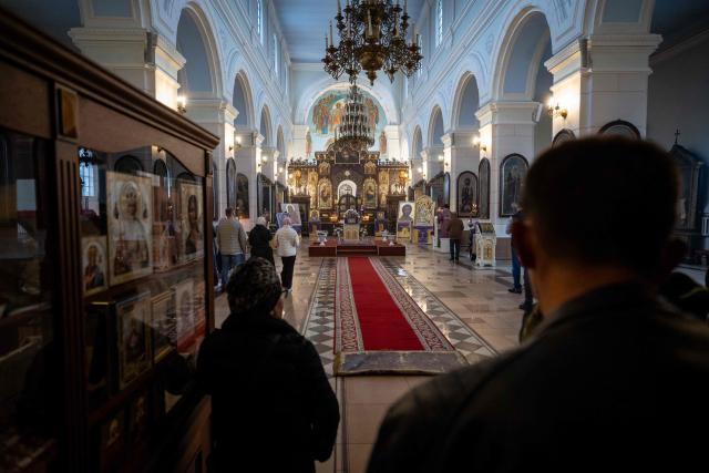 Residents attend a service at Saints Boris and Gleb Orthodox Cathedral in Daugavpils, Latvia, on September 25, 2026, ahead of the country's parliamentary elections on October 3. Latvia goes to the polls for parliamentary elections on October 3, 2026. (Photo by Wojtek RADWANSKI / AFP)