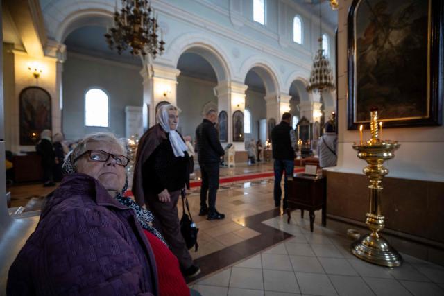 Residents attend a service at Saints Boris and Gleb Orthodox Cathedral in Daugavpils, Latvia, on September 25, 2026, ahead of the country's parliamentary elections on October 3. Latvia goes to the polls for parliamentary elections on October 3, 2026. (Photo by Wojtek RADWANSKI / AFP)