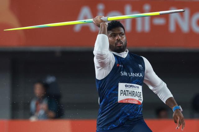 Sri Lanka's Rumesh Pathirage competes in the men's javelin throw final during the 2026 Asian Games at Nagoya City Mizuho Park Athletic Stadium in Nagoya, Aichi Prefecture on September 28, 2026. (Photo by DAVID GRAY / AFP)