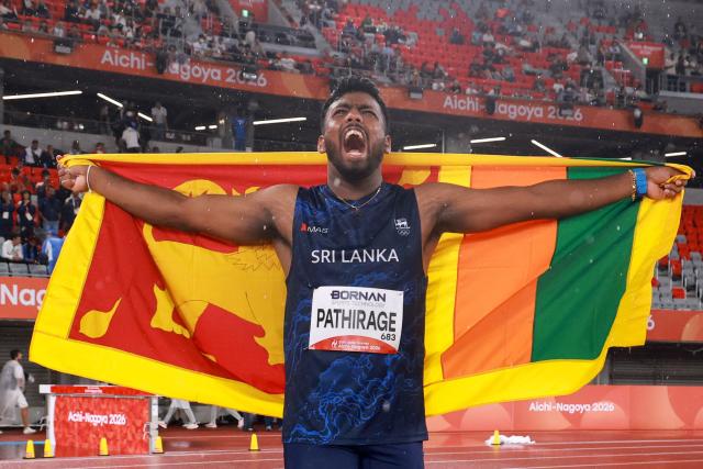 Sri Lanka's Rumesh Pathirage celebrates after winning the men's javelin throw final during the 2026 Asian Games at Nagoya City Mizuho Park Athletic Stadium in Nagoya, Aichi Prefecture on September 28, 2026. (Photo by DAVID GRAY / AFP)