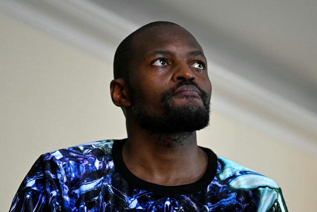 South African fashion designer Laduma Ngxokolo speaks during an interview following the MaXhosa Africa for the Women's Spring/Summer 2027 collection fashion show as part of the Paris Fashion Week, in Paris on September 28, 2026. (Photo by LOU BENOIST / AFP)