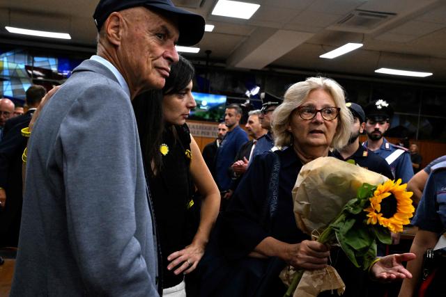 Italian student Giulio Regeni's parents, Claudio and Paola Regeni, and his sister react after the verdict in the trial of four Egyptian security officers accused of the murder of Giulio Regeni in Cairo in 2016. The officers, who were all convicted in absentia, were each given sentences of 10 years in prison. (Photo by Tiziana FABI / AFP)