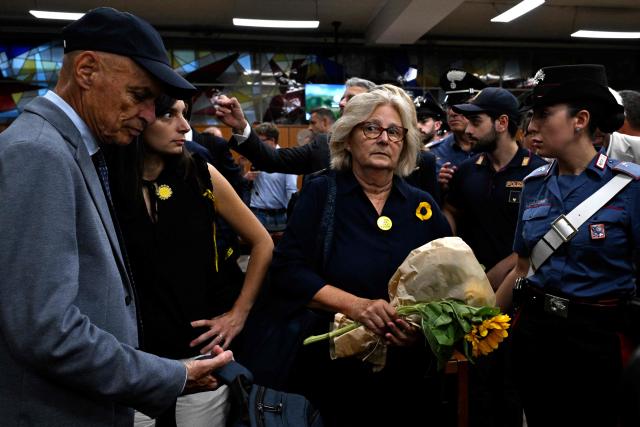Italian student Giulio Regeni's parents, Claudio and Paola Regeni, and his sister during the verdict in the trial of four Egyptian security officers accused of the murder of Giulio Regeni in Cairo in 2016. The officers, who were all convicted in absentia, were each given sentences of 10 years in prison, for the kidnapping and brutally murdering of the 28-year-old Regeni, who was in Cairo conducting research for his doctorate when he was abducted in January 2016. (Photo by Tiziana FABI / AFP)