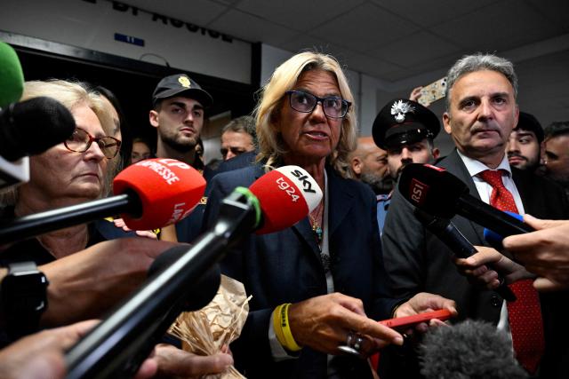 Lawyer Alessandra Ballerini speaks to the press next to Italian student Giulio Regeni's mother Paola Regeni, after the verdict in the trial of four Egyptian security officers accused of the murder of Giulio Regeni in Cairo in 2016. The officers, who were all convicted in absentia, were each given sentences of 10 years in prison. (Photo by Tiziana FABI / AFP)