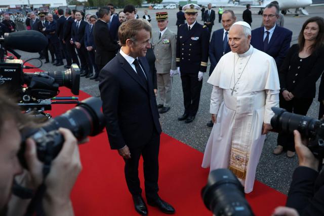 Pope Leo XIV and France's President Emmanuel Macron take part in a farewell ceremony, an official departure protocol marking the end of an apostolic journey, at Metz–Nancy–Lorraine Airport in Goin, northeastern France on September 28, 2026 on the last day of his visit to France. (Photo by ROMEO BOETZLE / POOL / AFP)