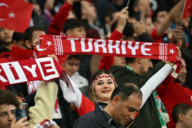 Turkish supporters cheer on their team ahead of the UEFA Nations League football match (League A, Group A1)  between Turkey and Italy at the Ataturk Sports Complex Matl? Stadium in Bursa on September 28, 2026. (Photo by Ozan KOSE / AFP)