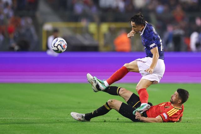 France's forward #19 Esteban Lepaul (TOP) fights for the ball with Belgium's defender #04 Brandon Mechele during the UEFA Nations League Group A1 football match between Belgium and France at King Baudouin Stadium in Brussels on September 28, 2026. (Photo by FRANCK FIFE / AFP)