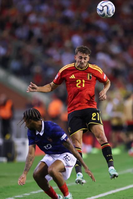 Belgium's defender #21 Timothy Castagne (R) fights for the ball with France's forward #12 Bradley Barcola during the UEFA Nations League Group A1 football match between Belgium and France at King Baudouin Stadium in Brussels on September 28, 2026. (Photo by FRANCK FIFE / AFP)