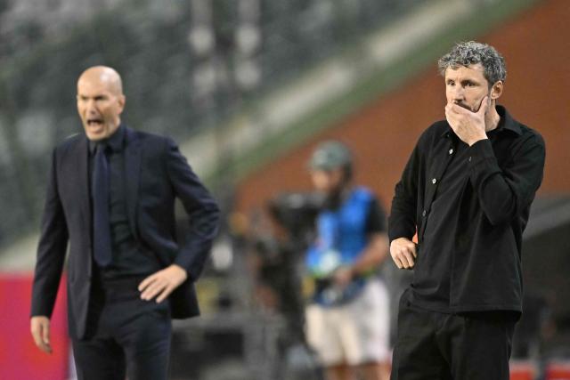 Belgium's Dutch head coach Mark van Bommel (R) gestures next to France's head coach Zinedine Zidane (L) during the UEFA Nations League Group A1 football match between Belgium and France at King Baudouin Stadium in Brussels on September 28, 2026. (Photo by NICOLAS TUCAT / AFP)