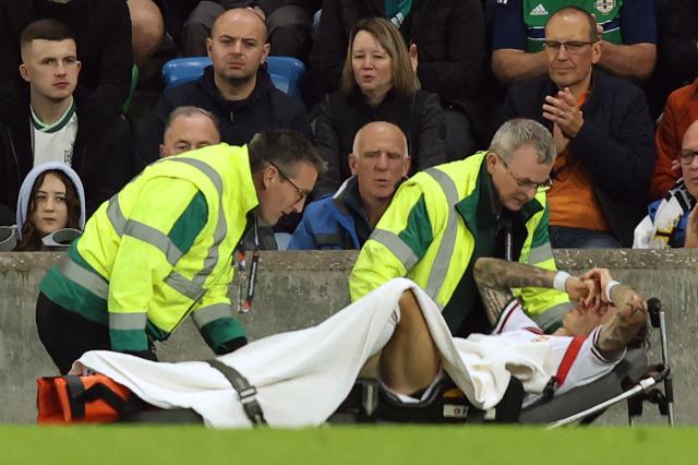 Hungary's midfielder #14 Bendeguz Bolla is taken off on a stretcher after picking up an injury during the UEFA Nations League, League B, Group 2 match between Northern Ireland and Hungary at Windsor Park in Belfast, Northern Ireland on September 28, 2026. (Photo by Paul Faith / AFP)