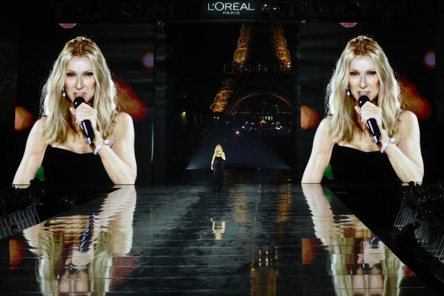 Canadian singer Celine Dion performs on the runway during the l'Oreal Paris for the Women's Spring/Summer 2027 collection fashion show as part of the Paris Fashion Week, with the Eiffel Tower in the background in Paris on September 28, 2026. (Photo by Kenzo TRIBOUILLARD / AFP)