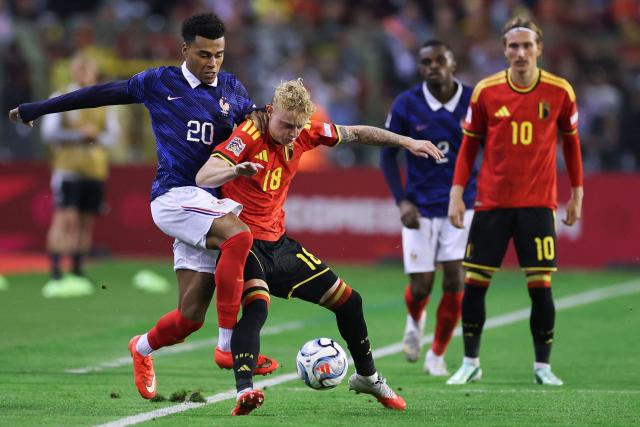 Belgium's midfielder #18 Joaquin Seys (C) fights for the ball with France's forward #20 Desire Doue (L) during the UEFA Nations League Group A1 football match between Belgium and France at King Baudouin Stadium in Brussels on September 28, 2026. (Photo by FRANCK FIFE / AFP)