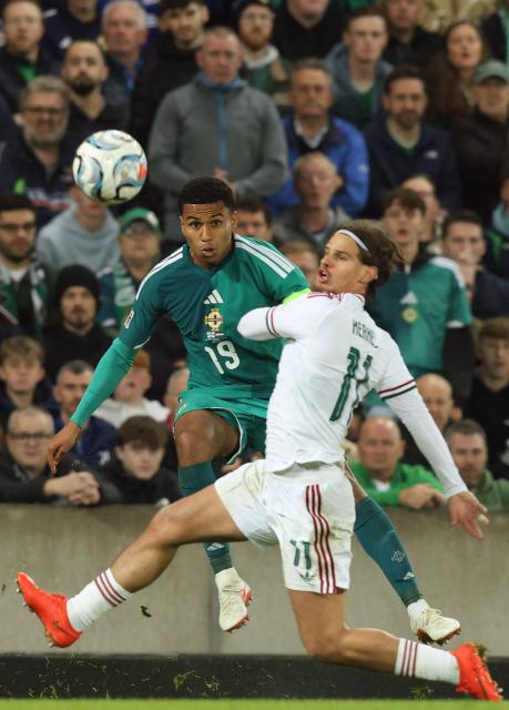 Northern Ireland's defender #19 Shea Charles (L) vies with Hungary's defender #11 Milos Kerkez (R) during the UEFA Nations League, League B, Group 2 match between Northern Ireland and Hungary at Windsor Park in Belfast, Northern Ireland on September 28, 2026. (Photo by Paul Faith / AFP)
