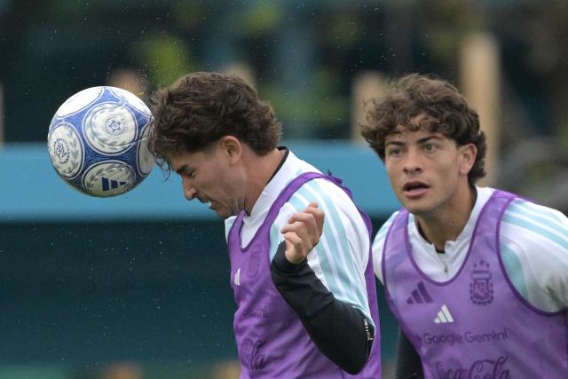 Argentina's forward Julian Alvarez (L) heads the ball next to teammate defender Agustin Giay during a training session at the Argentine Football Association (AFA) training camp in Ezeiza, Buenos Aires Province, on September 28, 2026 ahead of the friendly matches against Bolivia, Burkina Faso, and Benin. (Photo by JUAN MABROMATA / AFP)