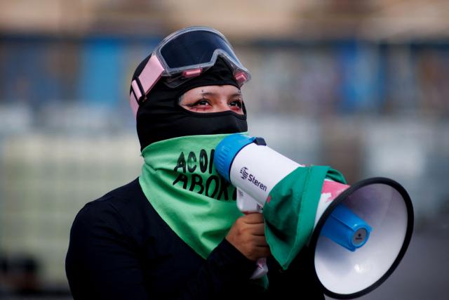 A demonstrator shouts slogans on a megaphone during a demonstration in favor of the decriminalization of abortion on the occasion of the International Safe Abortion Day in Mexico City on September 28, 2025. (Photo by Franyeli Garcia / AFP)