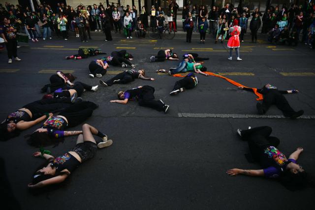 Demonstrators take part in a performance during a demonstration in favor of the decriminalization of abortion on the occasion of the International Safe Abortion Day in Santiago on September 28, 2026. (Photo by RODRIGO ARANGUA / AFP)
