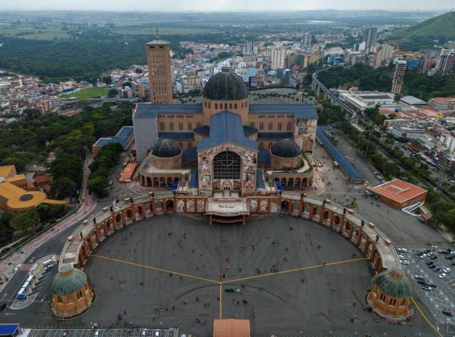 (FILES) Aerial view of the Basilica of the National Shrine in Aparecida, São Paulo State, Brazil, taken on April 18, 2025. A controversy surrounding a virgin worshiped in Brazil is igniting the campaign just six days before the October 4, 2026 elections, as President Lula and his rival Flavio Bolsonaro are tied in the polls and competing for religious voters in one of the countries with the largest Christian populations globally. (Photo by Roosevelt Cássio / AFP)