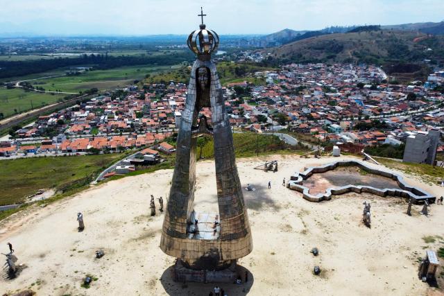(FILES) Aerial view of the new 50-meter steel statue of Our Lady of Aparecida, national patroness of Brazil, designed by artist Gilmar Pinna in Aparecida, Sao Paulo State, Brazil, on October 12, 2024. A controversy surrounding a virgin worshiped in Brazil is igniting the campaign just six days before the October 4, 2026 elections, as President Lula and his rival Flavio Bolsonaro are tied in the polls and competing for religious voters in one of the countries with the largest Christian populations globally. (Photo by Miguel SCHINCARIOL / AFP)
