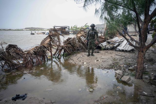A member of the Mexican Navy stands near a flooded area in Puerto San Carlos, Baja California Sur state, Mexico, on September 28, 2026, ahead of the arrival of Hurricane Polo. Strong winds battered Mexico's Baja California peninsula on September 28 ahead of the arrival of Hurricane Polo, a major El Nino-charged storm that is expected to cause severe damage on the Pacific coast. (Photo by Carl de Souza / AFP)