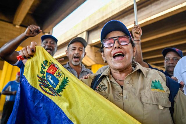 Workers and trade union members from Guayana's basic industries block access to industrial plants during a protest demanding the restoration of labour rights, free elections, the release of political prisoners and the return of opposition leader Maria Corina Machado in Puerto Ordaz, Bolivar state, Venezuela, on September 28, 2026. (Photo by Maryorin Mendez / AFP)