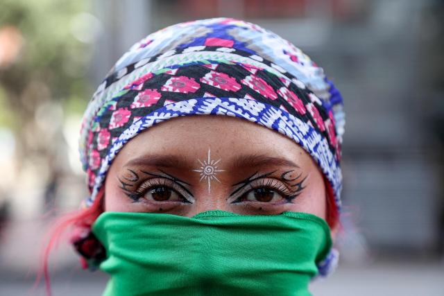 A woman poses for a picture during a demonstration marking Global Day of Action for Access to Safe and Legal Abortion in Bogota on September 28, 2026. (Photo by Andrea Ariza / AFP)