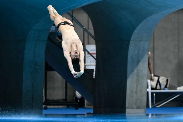 South Korea's Kim Yeong-taek competes in the men's 3m springboard preliminary diving event during the 2026 Asian Games at the Tokyo Aquatics Centre in Tokyo on September 29, 2026. (Photo by ANDREW CABALLERO-REYNOLDS / AFP)