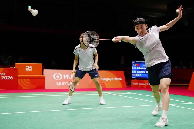 South Korea's Lee So-hee and Baek Ha-na play a point against China's Liu Shengshu and Tan Ning during the women's doubles badminton final during the 2026 Asian Games at the Ichinomiya City Municipal Gymnasium in Ichinomiya, Aichi prefecture on September 29, 2026. (Photo by Yuichi YAMAZAKI / AFP)