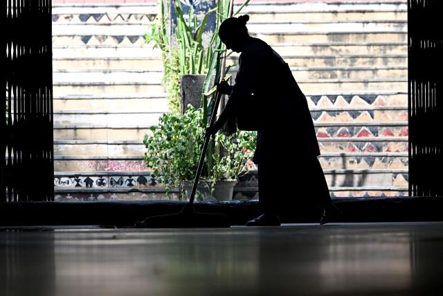 A sweeper cleans the floor of an underpass in New Delhi on September 29, 2026. (Photo by Sajjad HUSSAIN / AFP)