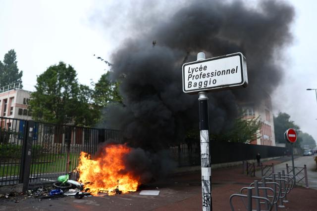Black smoke billows from burning bins and bicycles as students carry out a blocking protest at the Cesar Baggio secondary school during a day of nationwide public sector strikes and demonstrations, in Lille, on September 29, 2026. Public sector workers, including firefighters, hold a one-day strike and demonstrations across France on September 29 in response to a call from a broad inter-union coalition, with the aim of putting pressure on the government two days before the presentation of the draft budget for 2027. (Photo by Sameer AL-DOUMY / AFP)