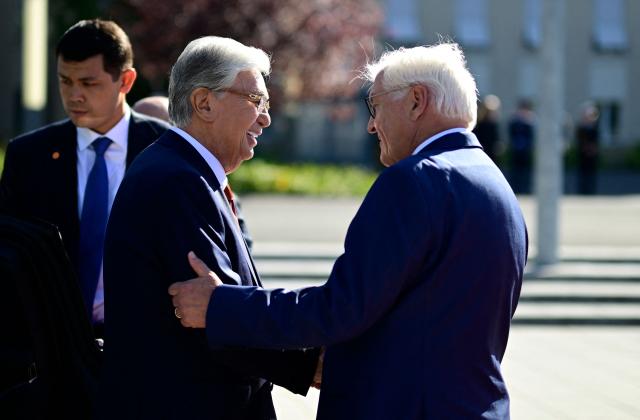German President Frank-Walter Steinmeier (R) shakes hands with Kazakhstan's President Kassym-Jomart Tokayev as he arrives for a welcome ceremony at the German Defence Ministry in Berlin on September 29, 2026. (Photo by Tobias SCHWARZ / AFP)