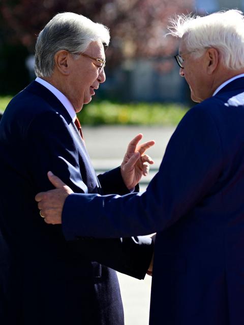 German President Frank-Walter Steinmeier (R) shakes hands with Kazakhstan's President Kassym-Jomart Tokayev as he arrives for a welcome ceremony at the German Defence Ministry in Berlin on September 29, 2026. (Photo by Tobias SCHWARZ / AFP)